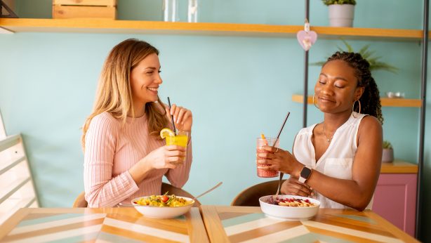 Women practicing mindful eating with healthy meals
